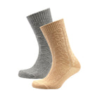 Two pairs of ribbed cable-knit socks, one in silver grey and one in camel, shown on invisible forms against a plain white background.