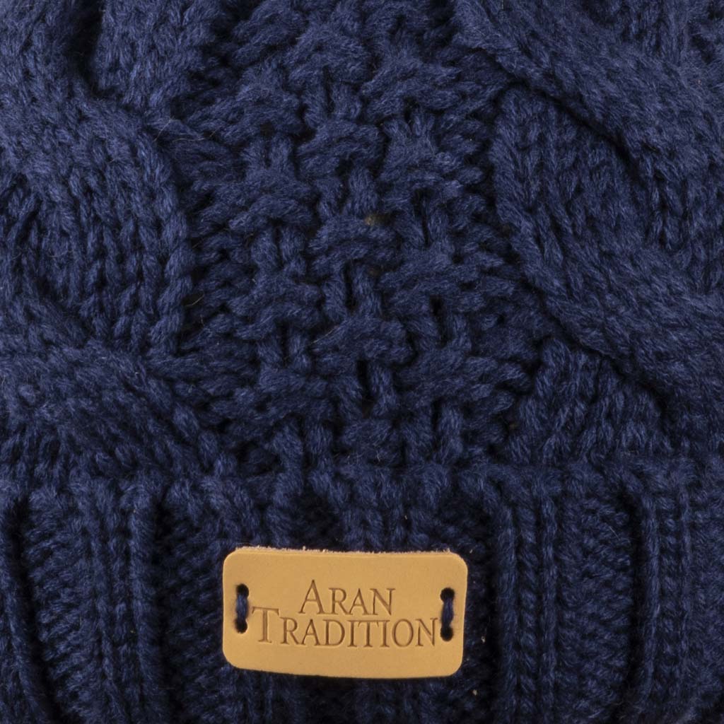 Stay Cozy & Chic with Aran Cable Pom Pom Hat | Traditional Cable Knit