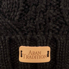 Stay Cozy & Chic with Aran Cable Pom Pom Hat | Traditional Cable Knit