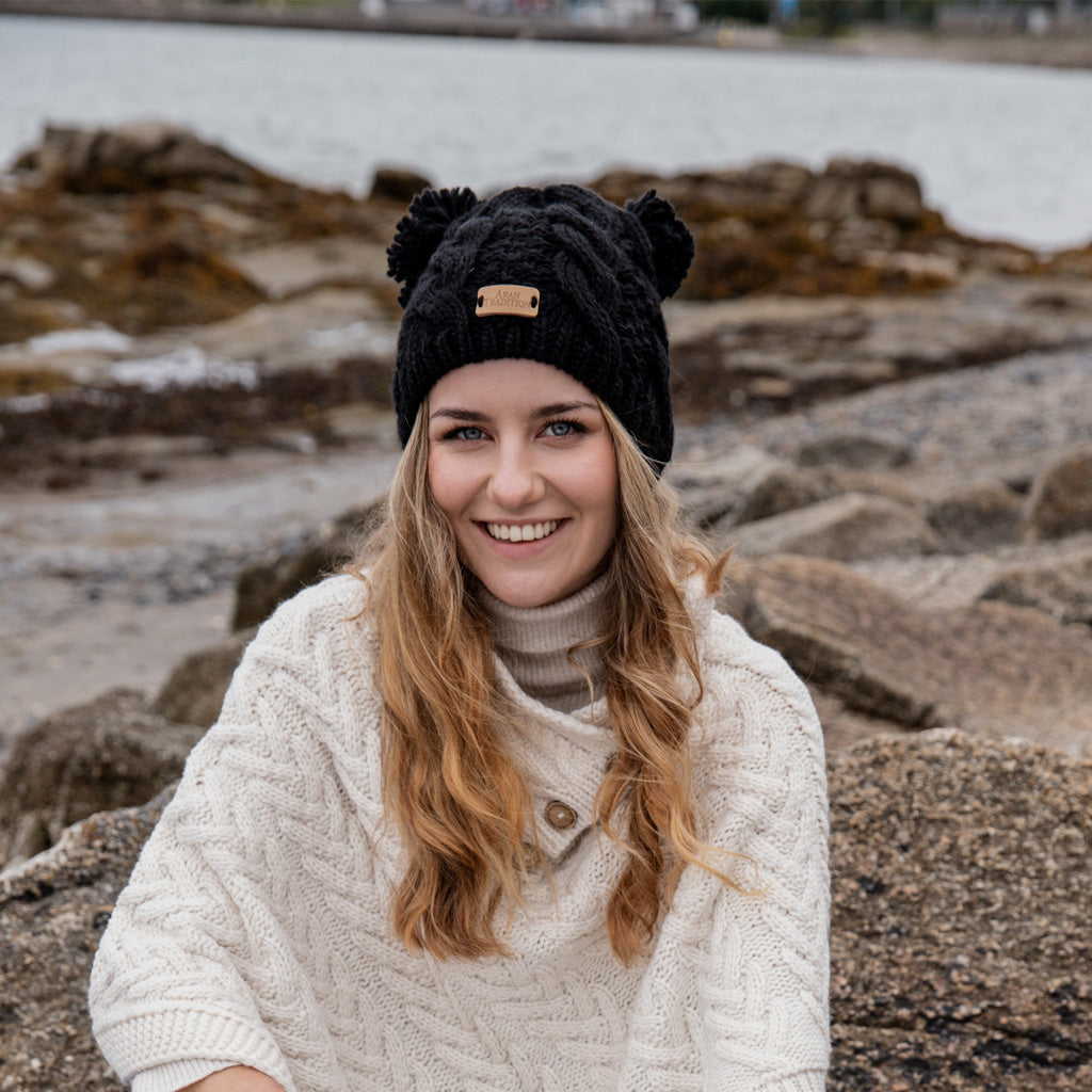 Stay Cozy & Playful with Aran Cable Double Pom Pom Hat