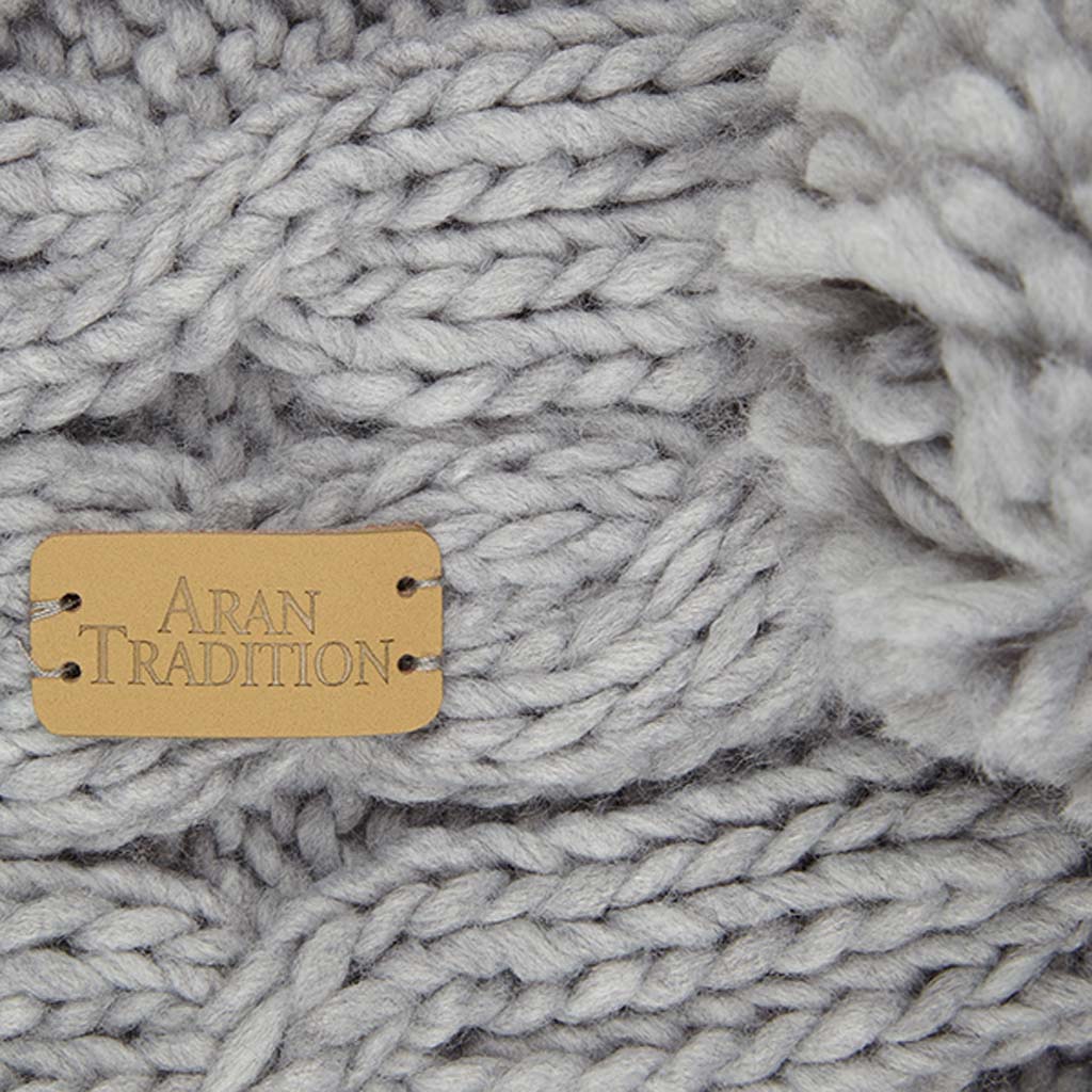Elevate Your Winter Style with Aran Cable Knit Pom Pom Scarf
